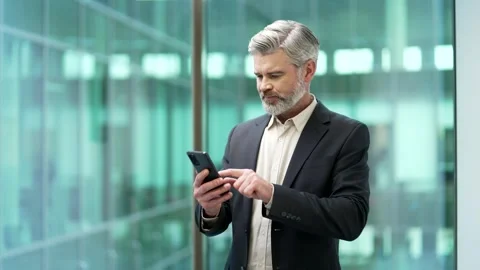 Worried businessman having problems with software or service on smartphone mobil Stock Footage 325428358