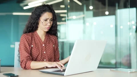 Worried businesswoman having problems with software or service on laptop  Stock Footage 301789765
