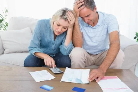 Worried couple going over finances Stock Photos