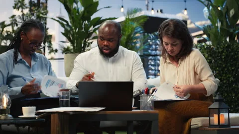 Worried coworkers react with shock to falling performance metrics during meeting Stock Footage 345163463