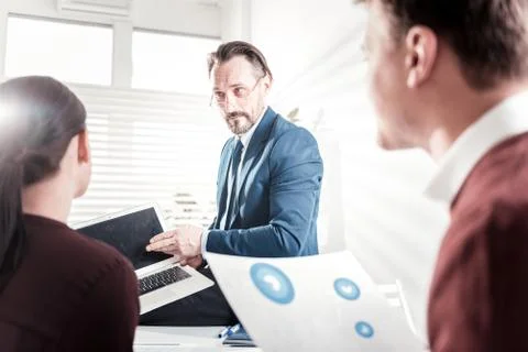Worried male boss explaining errors Stock Photos