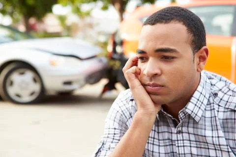 Worried Male Driver Sitting By Car After Traffic Accident Stock Photos
