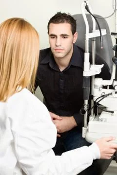 Worried male patient listening diagnose Stock Photos