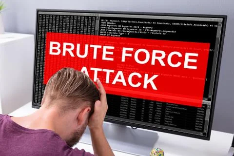 Worried Man At Computer With System Failure On The Screen Foto stock
