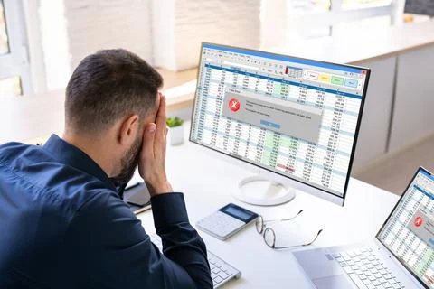 Worried Man At Computer With System Failure Screen 写真素材