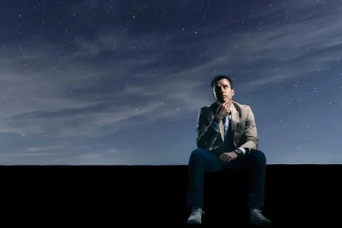 Worried man in night. Problems solving concept Stockfoto's