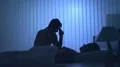 The worried man sit near the woman on the bed. night time 4k or 4k+ Resolution