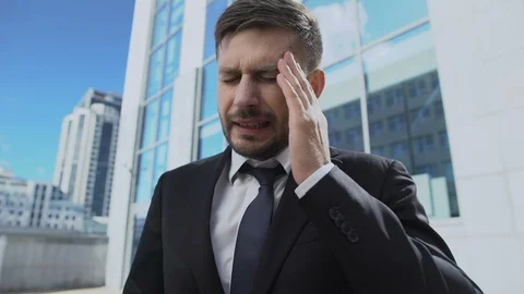 Worried man taking pill feeling sudden attack of headache responsible healthcare Stock Footage 119282735