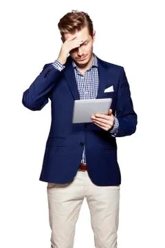 Worried man using digital tablet Stock Photos