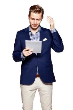 Worried man using digital tablet Stock Photos