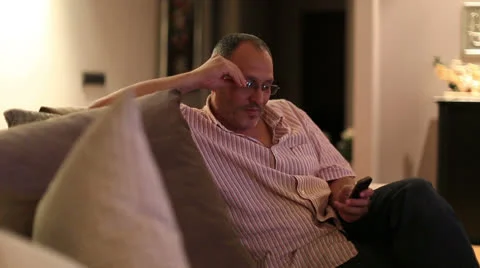 Worried middle age man talking cell phone Stock Footage 25169809