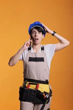 Worried stressed construction worker receiving bad news Stock Photos