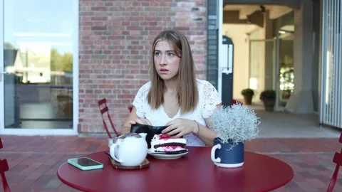 Worried student finds empty wallet and cannot afford her cafe meal Stock Footage 345027876