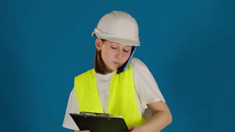 Worried taskmaster talks via phone reporting about problem Stock Footage 273920601