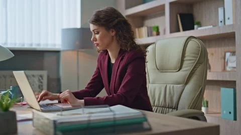 Worried worker typing computer solving business problem at company workplace. Stock Photos