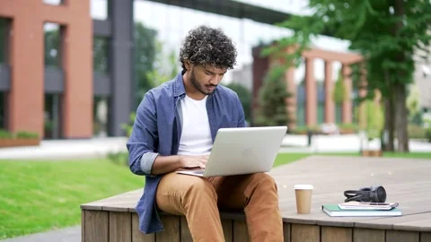 Worried young man having problems with software or service on laptop computer  Stock Footage 302472090