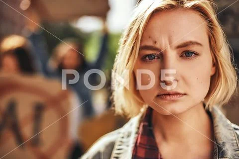 Worry about my planet. Close up portrait of sad female activist crying and Stock Photos