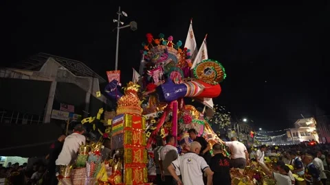 Worshippers express devotion by throwing joss paper Stock Footage 263975795