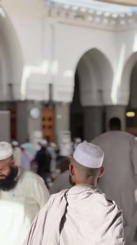 Worshippers Greeting and Walking Inside Masjid Quba Stock Footage 344060269