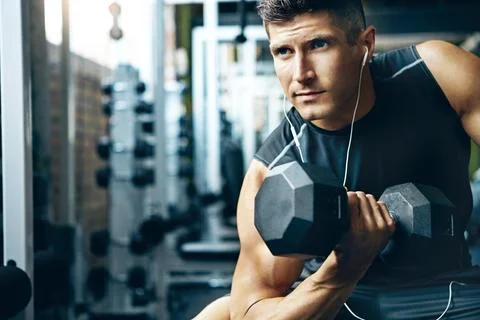 The worst thing you can be is average. a man doing a upper-body workout at the Stock Photos