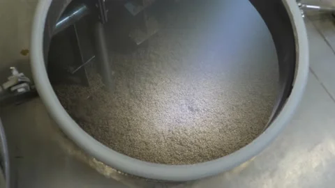 Wort mashing and boiling machine at work. Stirrer mixes malt Stock Footage 149662472