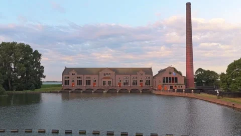 Wouda pumping station reflecting the sunrise over water Vidéo 341876363