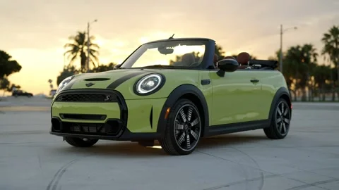 Wound up two door Mini Cooper S convertible with brown leather interior and Stock Footage 261247709