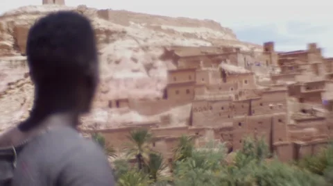 Wounded Black Guy Looks Around At The Sand House Of Morocco 08 Stock Footage 67527567