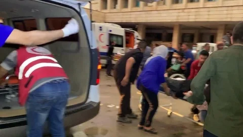 A Wounded Man Being Brought to an Ambulance co Stock Footage 120941302