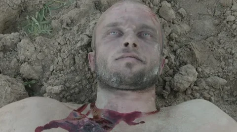 The wounded man being dragged along the ground. Stock Footage 68609647
