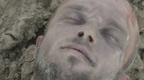 The wounded man being dragged along the ground. Stock Footage 68610071