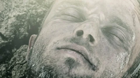 The wounded man being dragged along the ground. Video stock 68622574