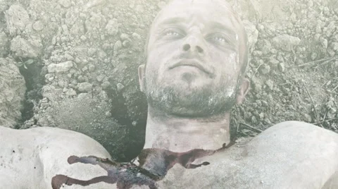 The wounded man being dragged along the ground. Stockbeeldmateriaal 68622622