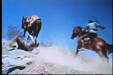 Wounded man tumbling off horse during ambush Vídeos de archivo 11366474
