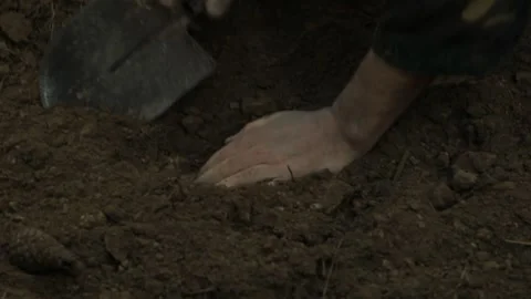 A wounded soldier digs in the ground 10 Stock-Footage 323022777