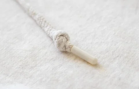 Woven background with beige string close-up with bokeh. Knitted texture wit.. Stock Photos