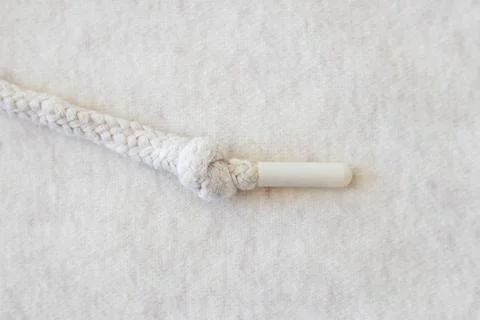 Woven background with beige string close-up with bokeh. Women's sportswear Stock-Fotos