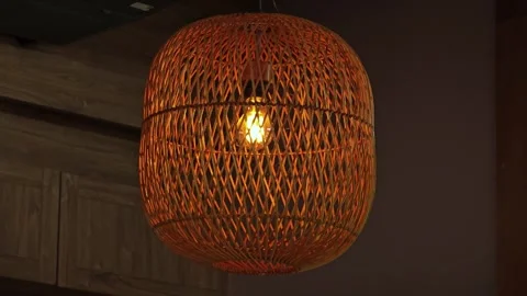 Woven bamboo lamp hanging on ceiling. Stock Footage 310550790