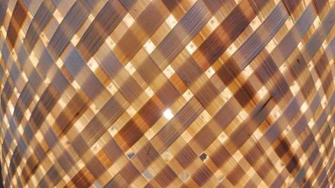 Woven bamboo texture with warm light pattern background Stock Photos