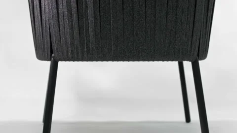 Woven black rope back of a modern designer chair. Insulated. Stock Footage 219426664