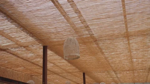 Woven ceiling canopy with hanging wicker lamp decoration Stock Footage 331359336