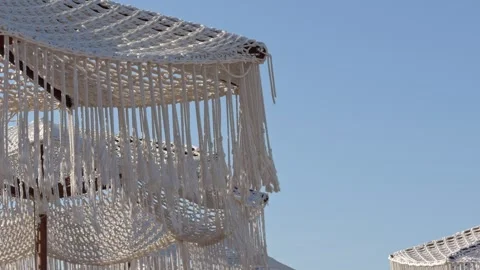 Woven Macrame Canopy Against Clear Sky and Building Stockbeeldmateriaal 342686308