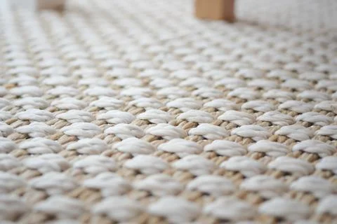 Woven material seen on the floor in a simple room Stock Photos