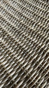 Woven strands form a tight, repeating pattern. Stock Photos