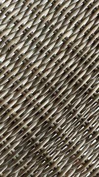 Woven strands form a tight, repeating pattern. Stock Photos
