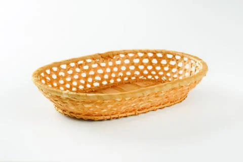 Woven straw basket with hole pattern Stock Photos