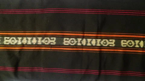 Woven textile with unique pattern from Indonesia, textured fabric background Stock Photos