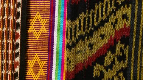 Woven textile with unique pattern from Indonesia, textured fabric background Stock Photos