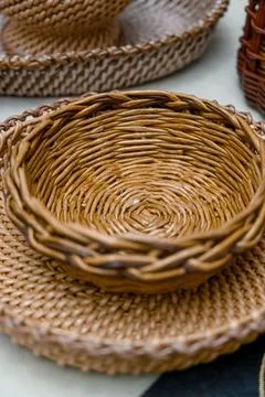 Woven wicker baskets in various sizes displayed on a table Stock Photos