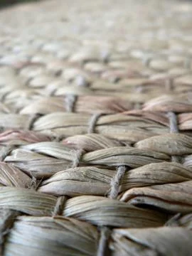 Woven wicker carpet texture. Stock Photos